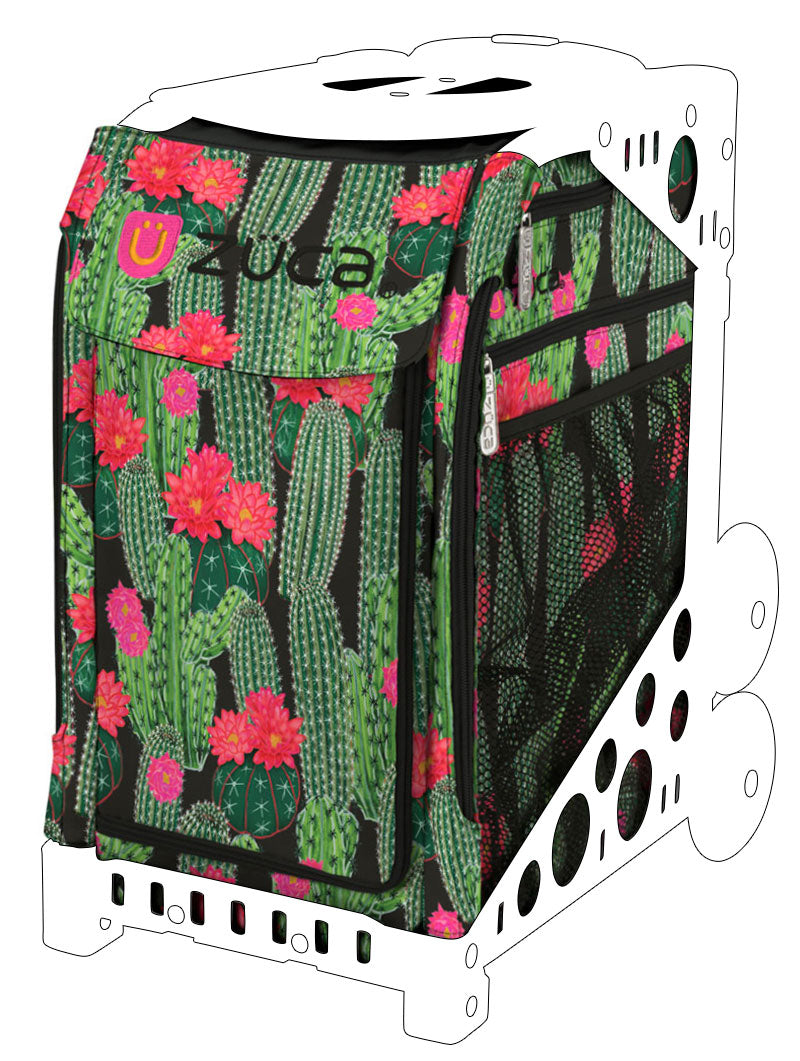 a suitcase filled with green and red flowers