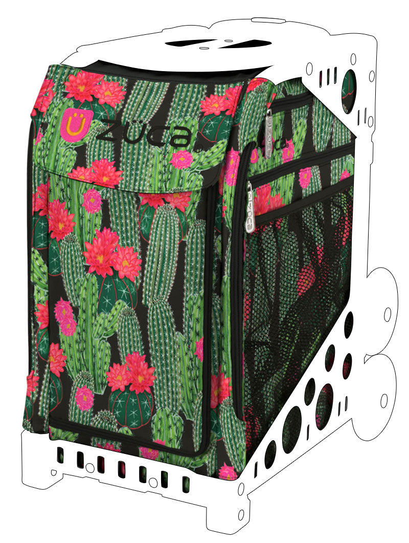 a suitcase filled with green and red flowers 