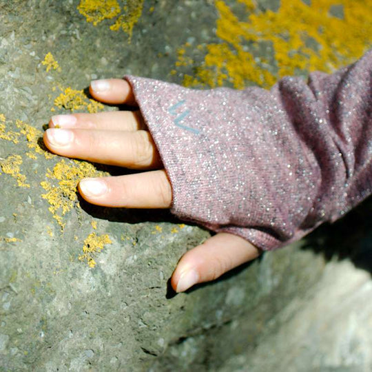 a close up of a person holding a bird 